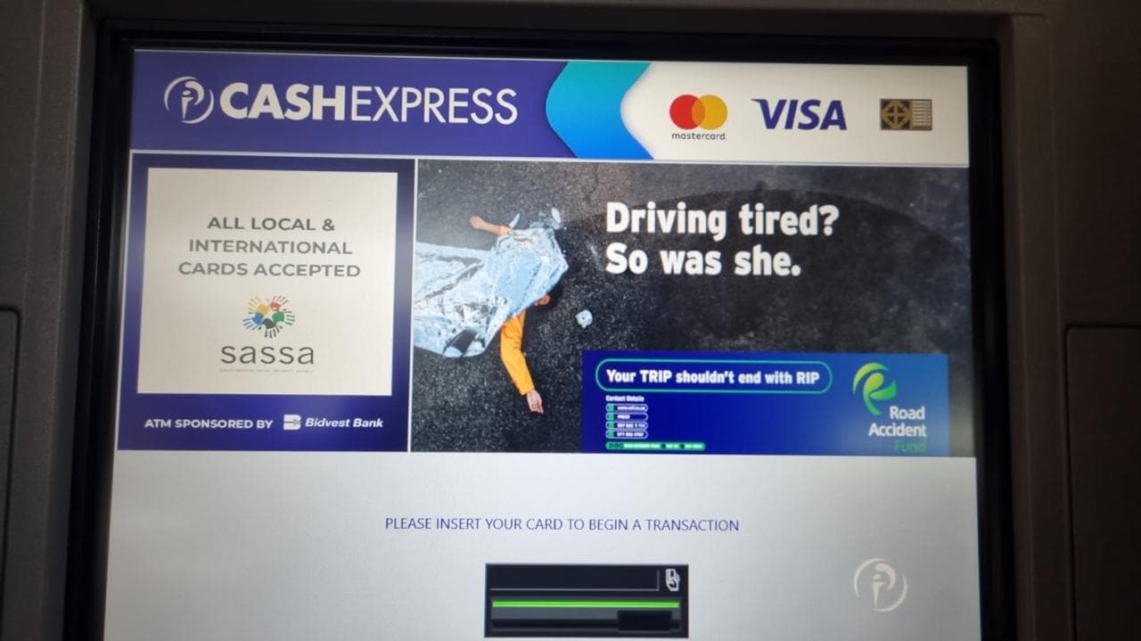 Cash Express ATM screen running the Road Accident Fund ad "Driving tired? So was she."