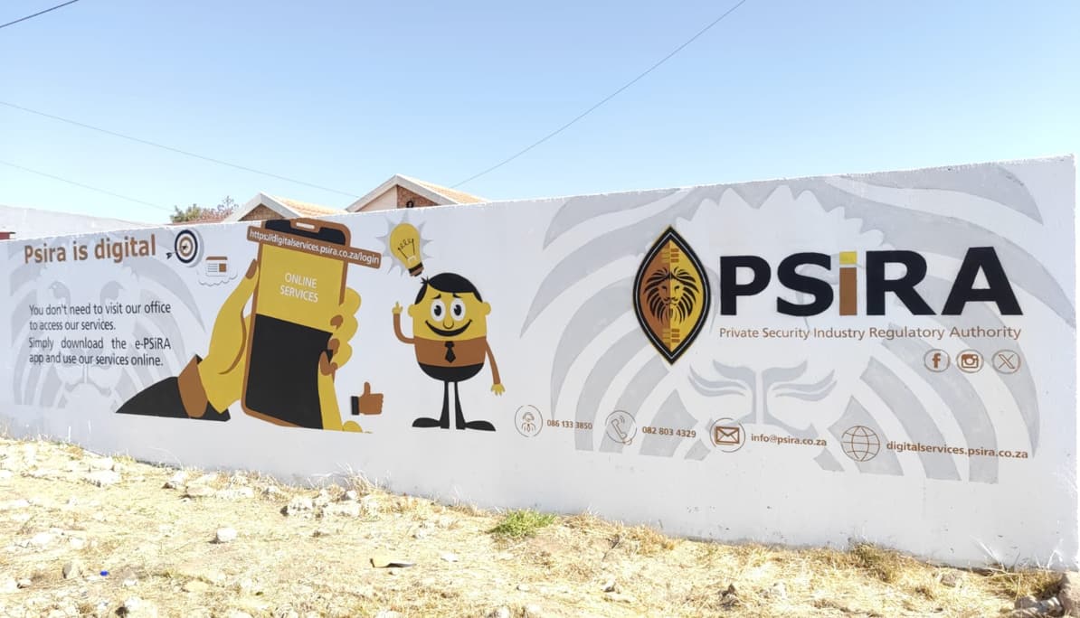 PSiRA "PSiRA is digital" mural painted along a long white boundary wall